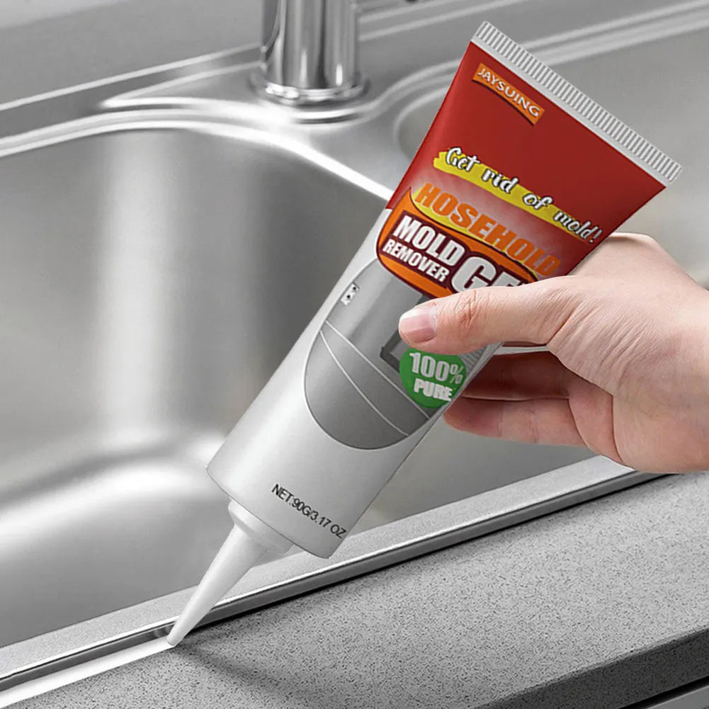 Hand applying mold remover gel to a kitchen sink edge with a tube labeled 'Mold Gel'.